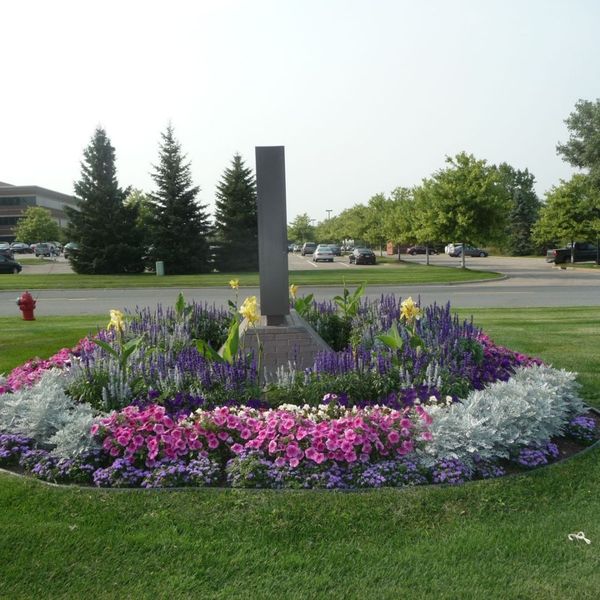 flowerbed around business sign