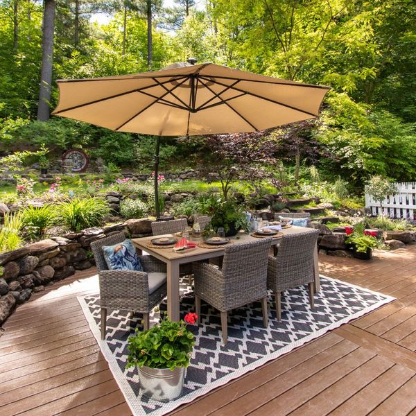 a patio set with an umbrella Top Summer Landscaping Ideas to Beat the Heat in St Paul (4).jpg