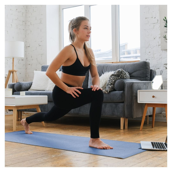 woman doing yoga in apartment