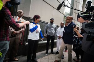 3. Eric Riddick_s mother answering questions outside the Criminal Court.jpg