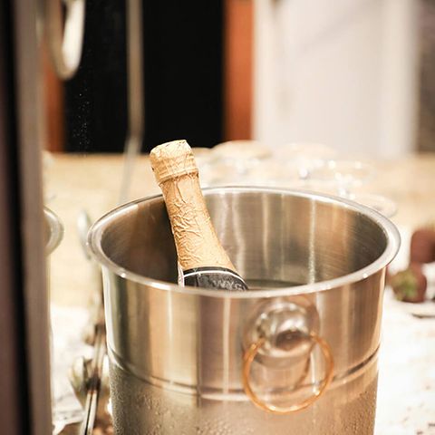 A champagne bottle in a bucket