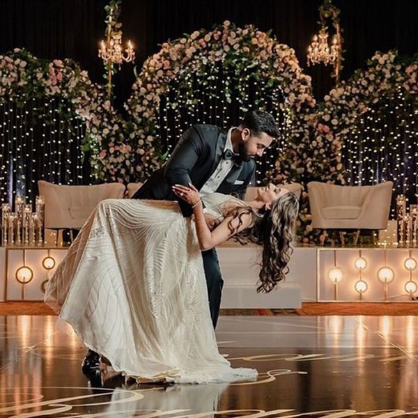 A couple dancing at their luxurious wedding