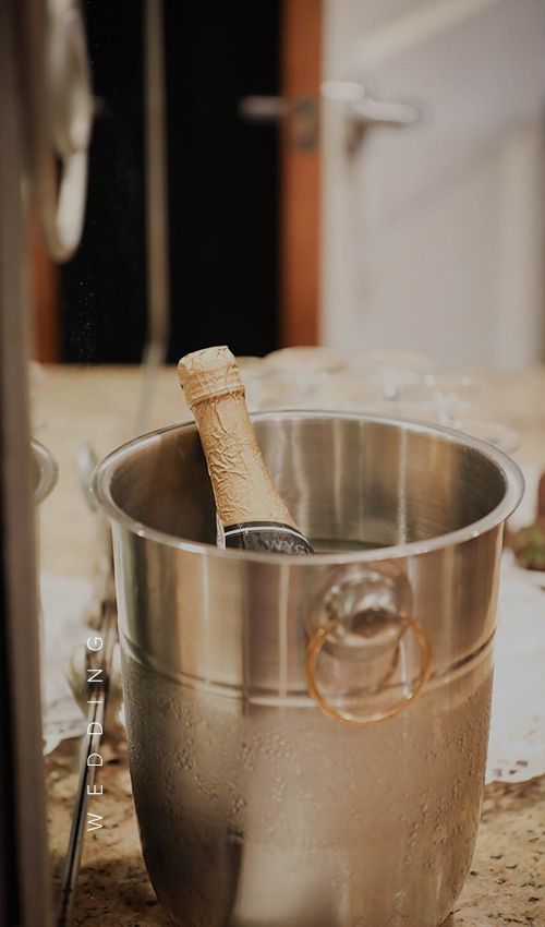 A bottle of champagne chilling in a bucket
