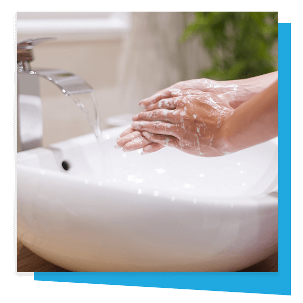 hands being washed under sink