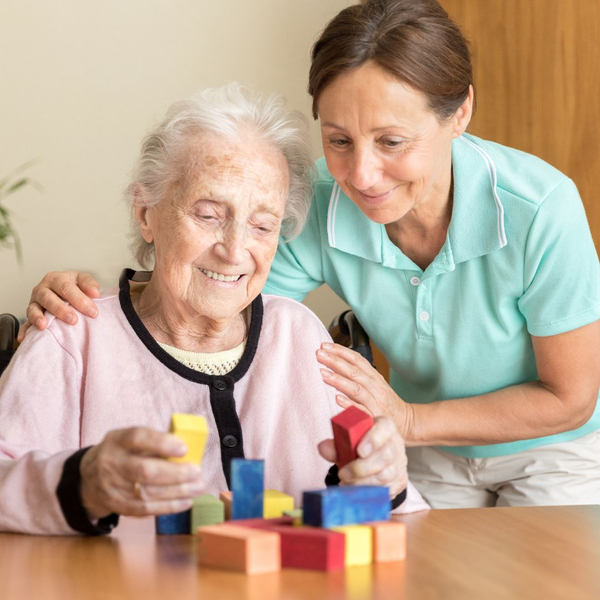 woman with dementia building blocks