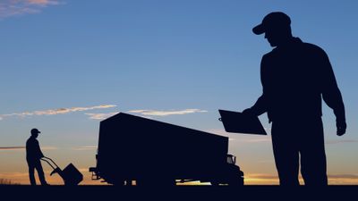 Silhouette of couriers, their packages, and truck