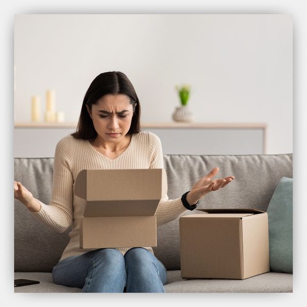 Woman upset opening a package