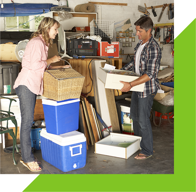 Couple wondering what to do with junk in garage, maybe they'll call EZ-haulers