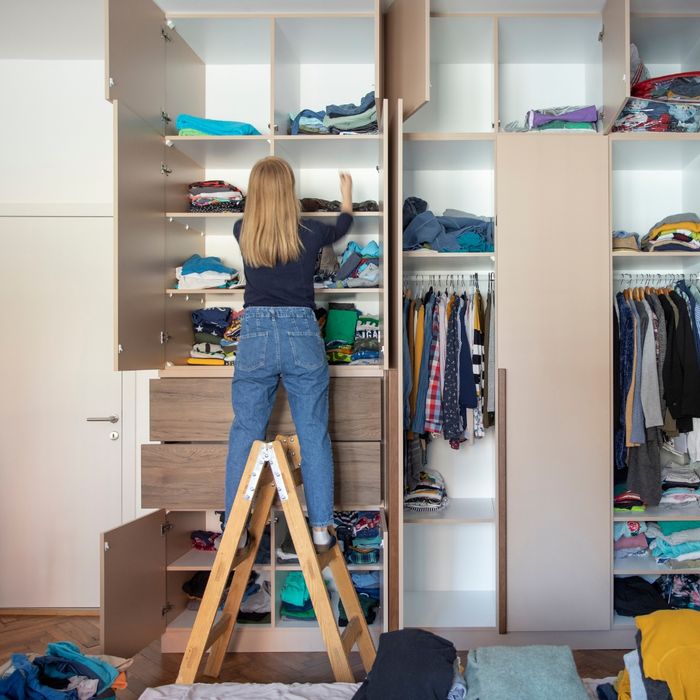 Woman organizing her closet space