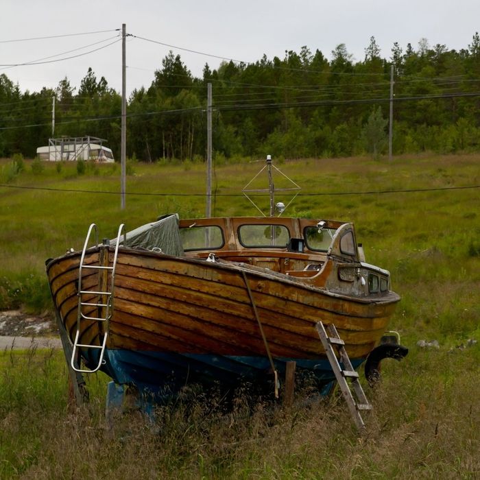 old wooden boat on dry land
