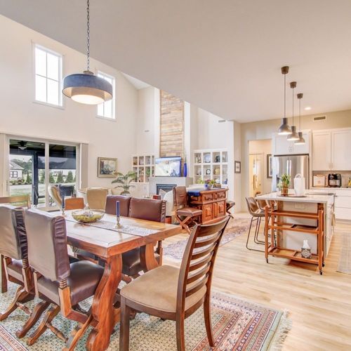 Open-concept dining room and kitchen with high ceilings