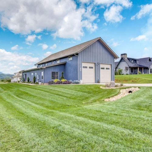Modern gray house with a large green lawn