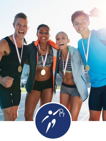 a group of athletes wearing medals