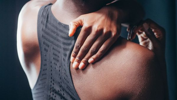 athlete clutching back