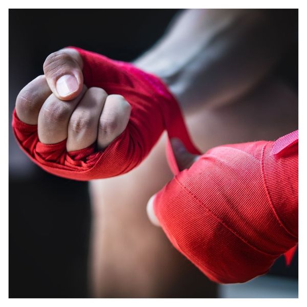 close up of wrapping hands before boxing match