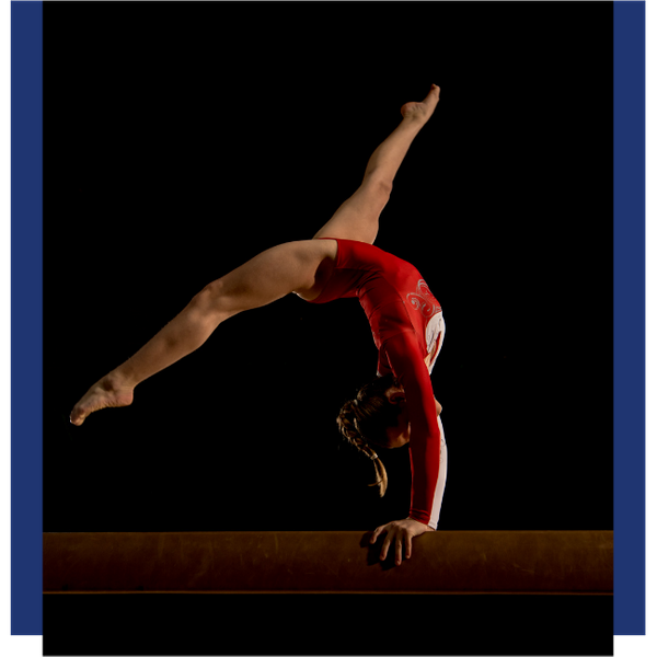 female gymnast on balance beam