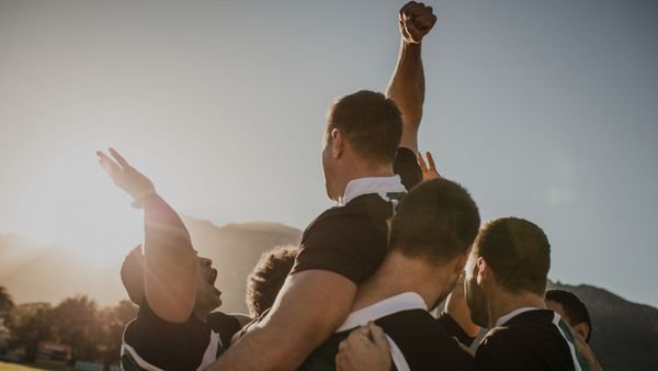 mens rugby team celebrating