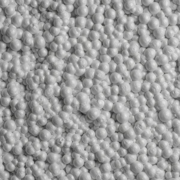 A close-up, microscopic view of the dense, closed-cell structure of spray foam. Spray Foam vs. Traditional Insulation3.jpg