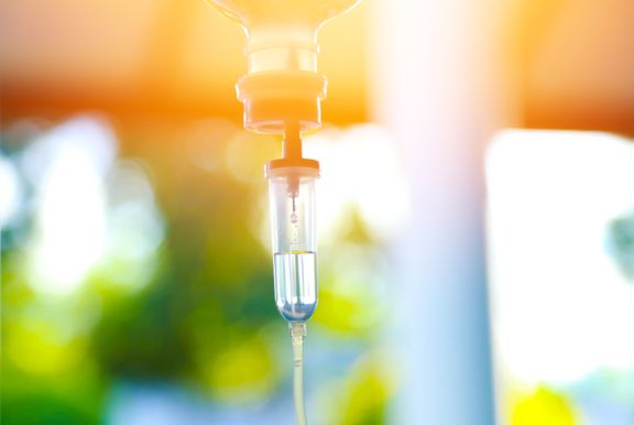 IV drip, soft lighting, window outdoors in background