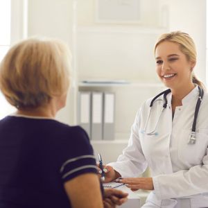 a woman consulting with a doctor Pain Cream.jpg