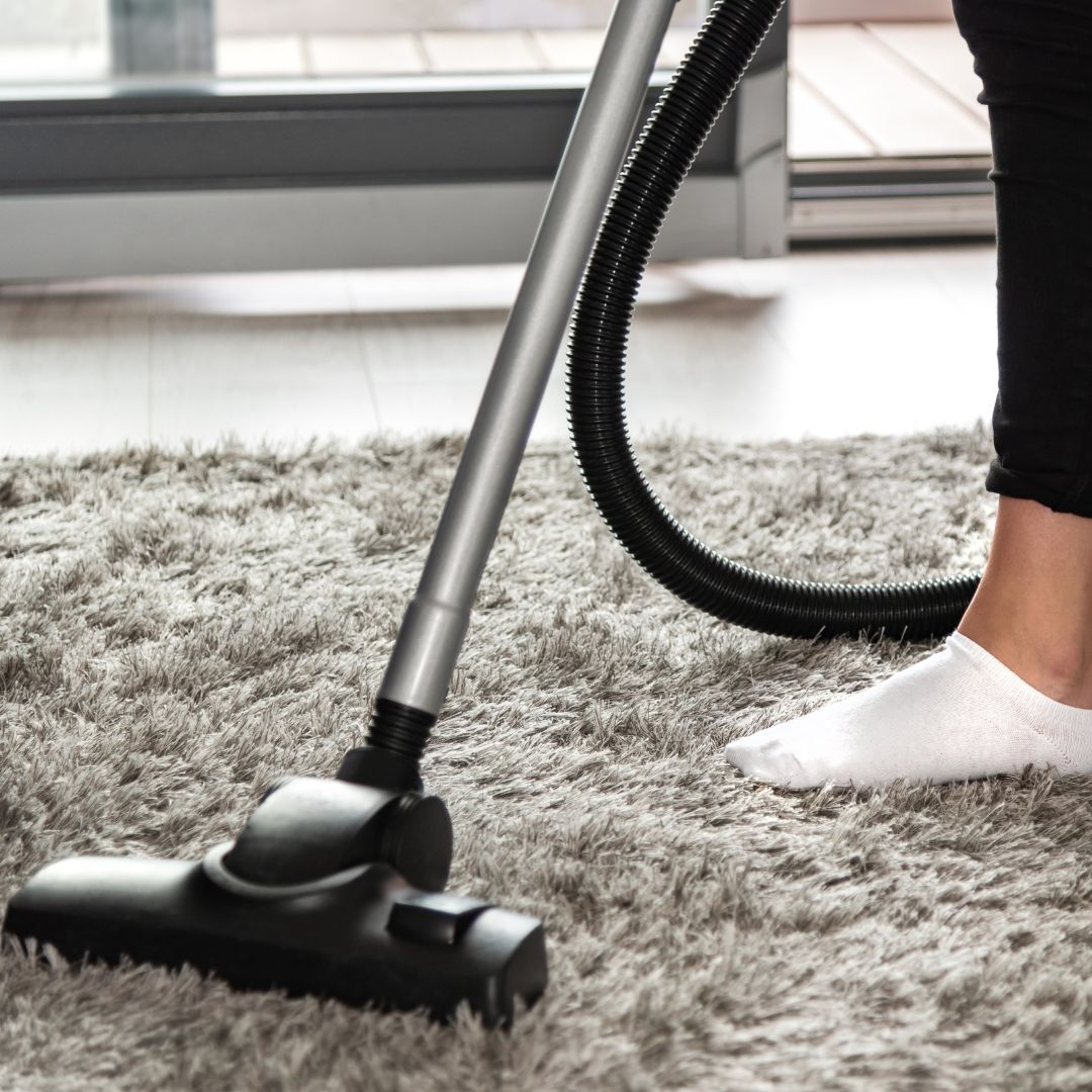 vacuuming a rug