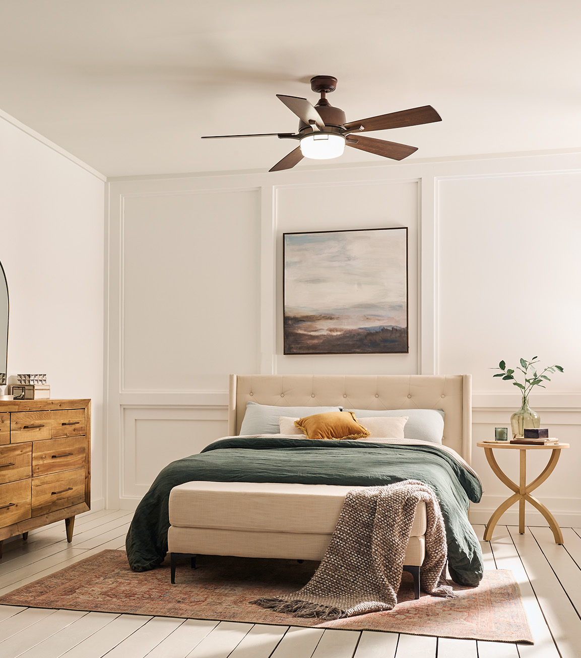 bedroom with plant, blankets, wood accents