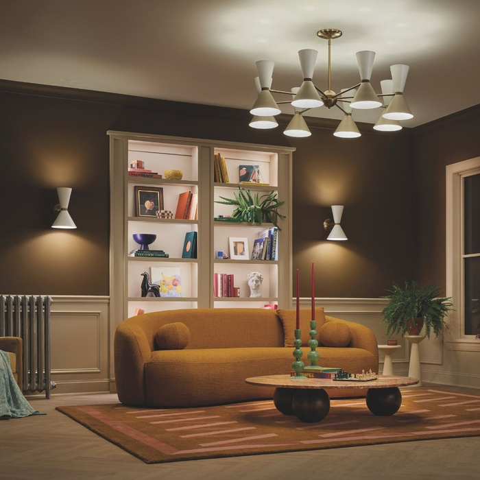 Cozy living room with orange sofa and modern chandelier.