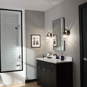 bathroom with sconce lighting