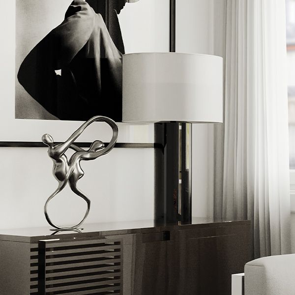 lamp on side table with sculpture