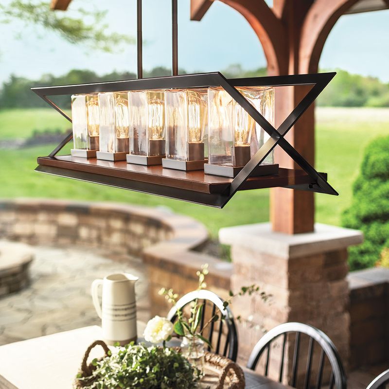 Outdoor pendant track light above table