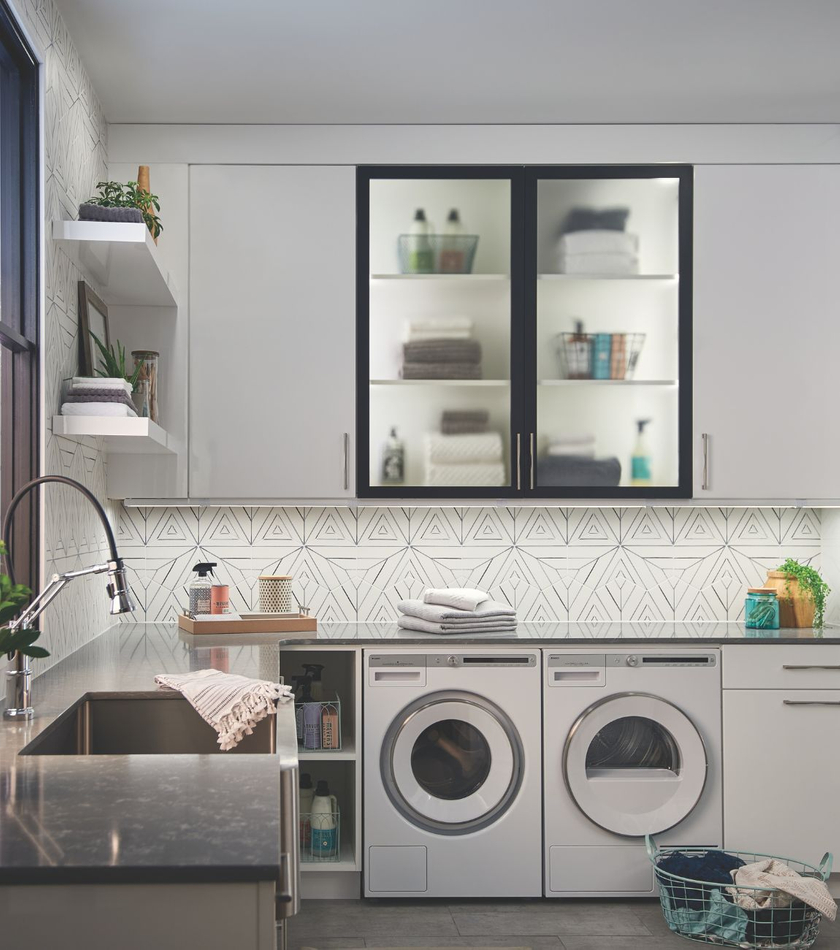 Modern laundry room with natural lighting and multiple lighting styles