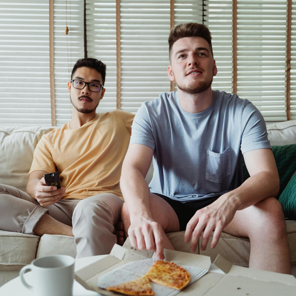 Two rommates watching TV. Two rommates watching TV.