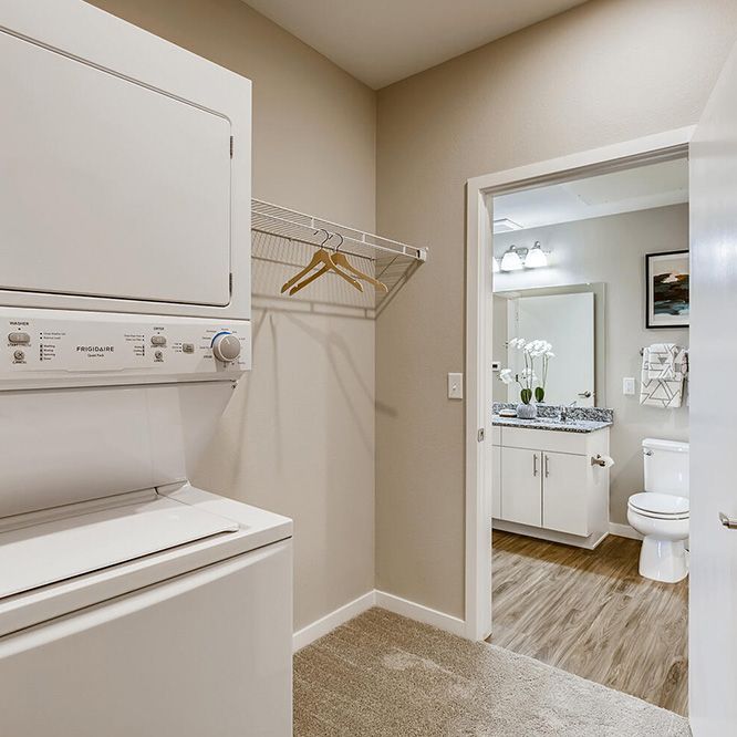 Bathroom and washer and dryer in Ten West apartment
