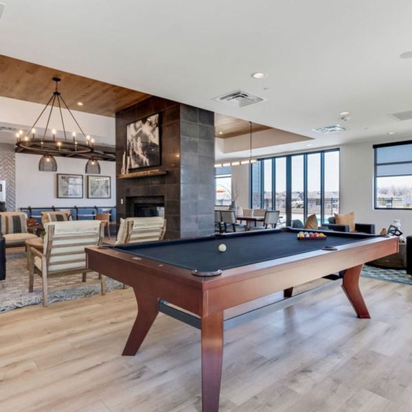 a pool table at Ten West Apartments