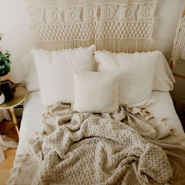 Bed with pillow and a comfy blanket. 