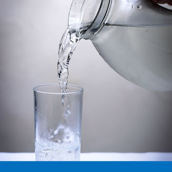 pouring glass of clean water