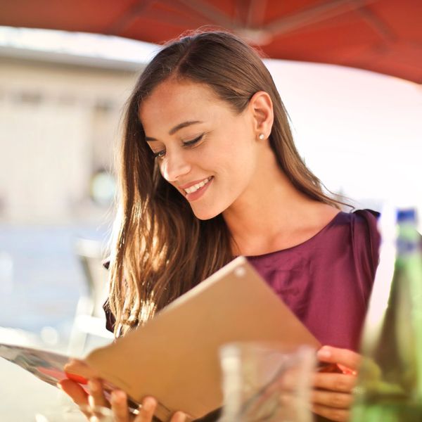 woman looking at a menu