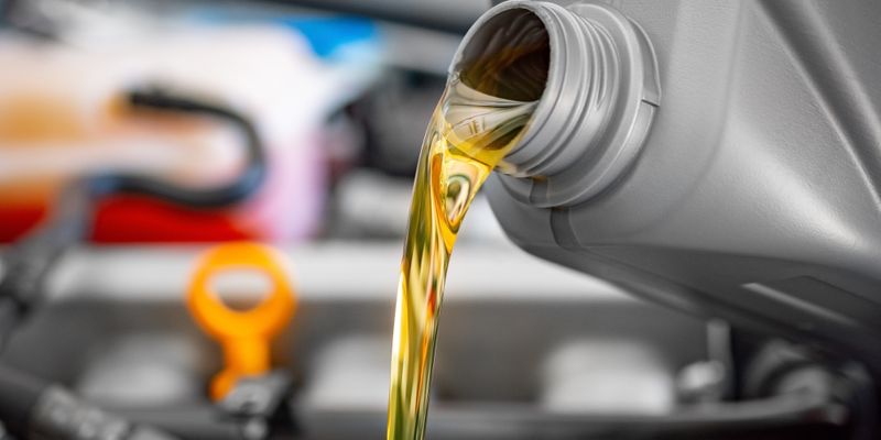 oil pouring into car