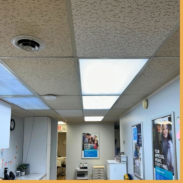 Flush LED flat panel light fixtures installed in a commercial drop ceiling
