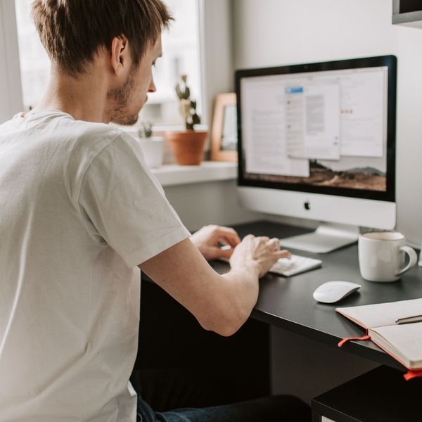 man using computer to take practice exams 