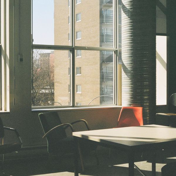 Sunlit room with chairs and large windows