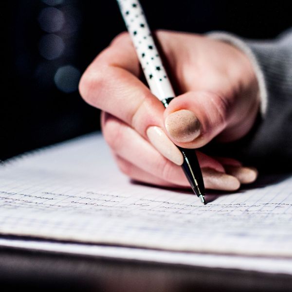 person taking notes person taking notes