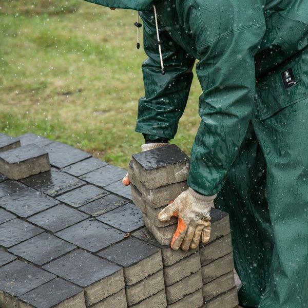stonemason carrying bricks