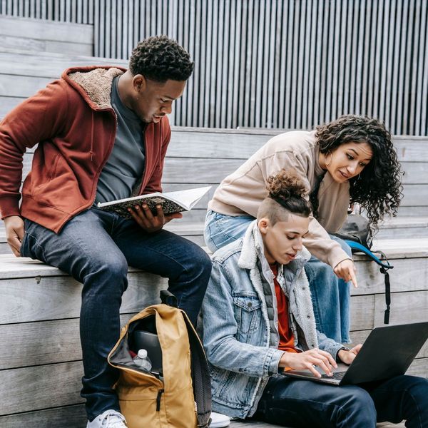 A group of students studying together in a collaborative and supportive environment. A group of students studying together in a collaborative and supportive environment.