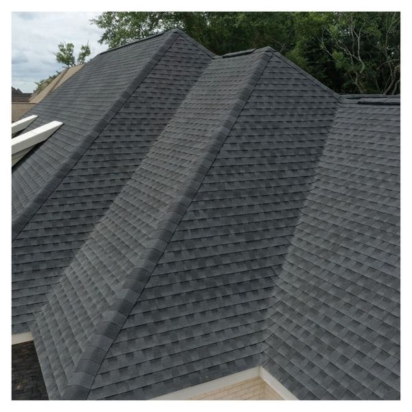 A newly installed shingle roof with proper ridge ventilation