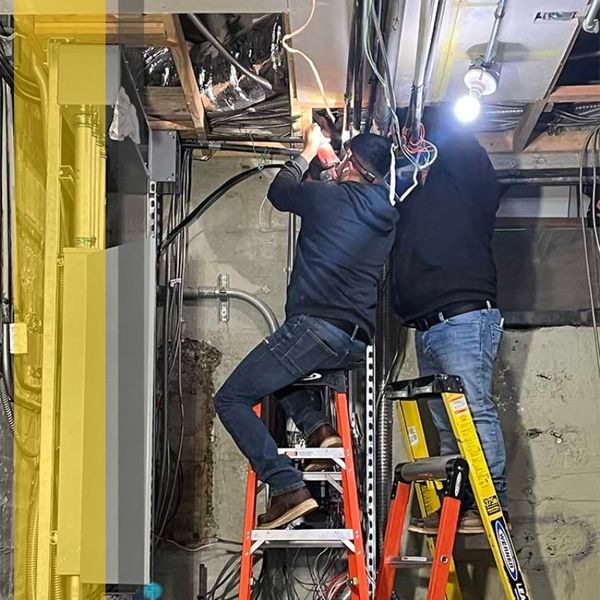 electricians working on lighting