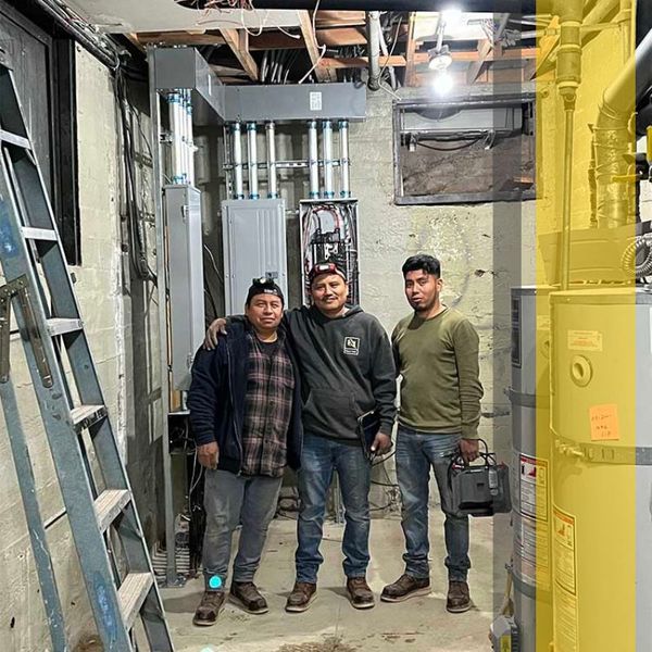 electricians in electrical room