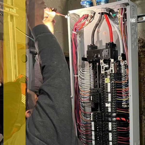 electrician working on panel