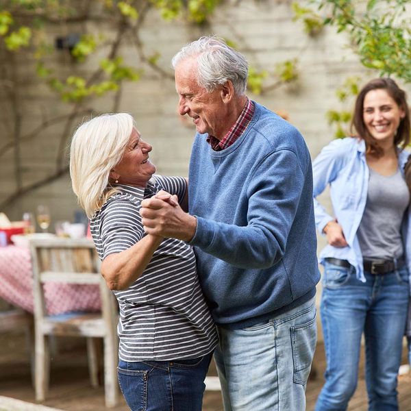 older couple dancing outside