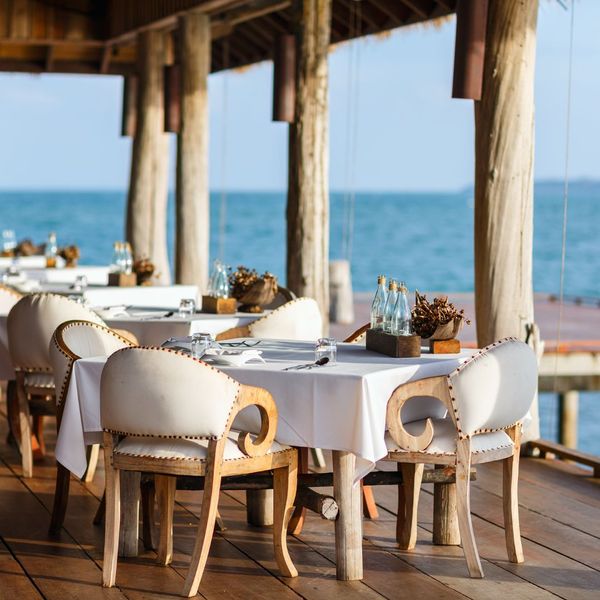 table and chairs set up on pier